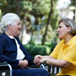 Ombudsman and woman on bench