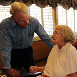 Male Ombudsman Visiting Female Resident at Care Facility